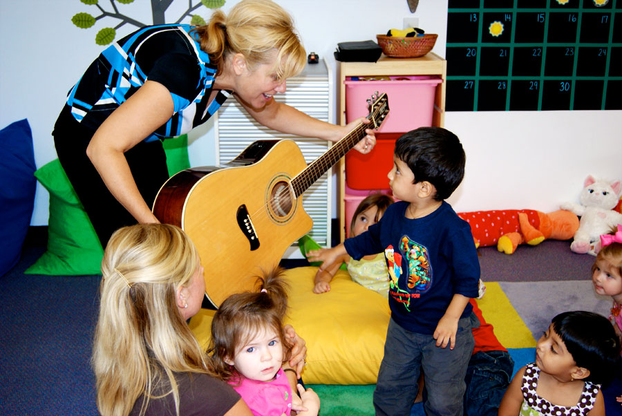 Miss Joanie introduces Sankal to her favorite guitar "Brownie"