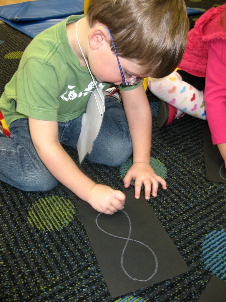 Using a Toothpick to Poke "Stars" into our Number Eight